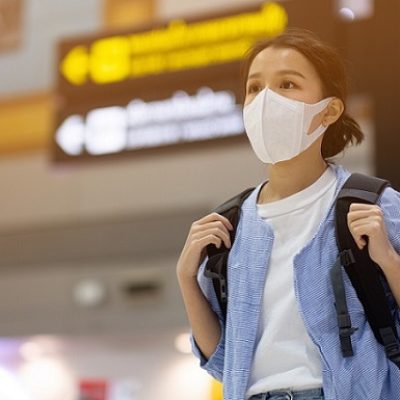 Asian travelers girl with medical face mask to protection the coronavirus in airport